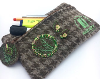 Feather/cosmetic bag made from sheep's wool and embroidered by hand