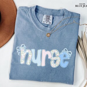 Nurse Comfort Colors® Floral Shirt, Bow Nurse Shirt, RN Shirt, Nurse Graduation Gift, Nurse Week Shirt, Nurse Appreciation, Gift For Nurse