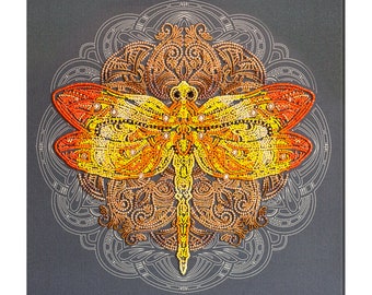 May include: A colorful dragonfly with orange, yellow, and white wings is depicted in a diamond-shaped mandala pattern. The dragonfly is surrounded by a detailed, intricate design of brown and white beads.