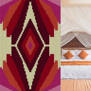 May include: A red, orange, and pink geometric pattern rug with a white diamond shape in the center. The rug is in front of a white bed with orange pillows and a white blanket.
