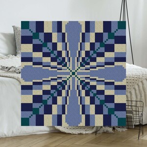 May include: A square artwork with a geometric pattern in blue, cream, and teal. The design features a symmetrical arrangement of squares and elongated shapes, forming a cross-like central design. The artwork is displayed on a white wall.