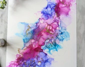 Peut inclure: Peinture abstraite avec des couleurs rose, bleu et or. Les couleurs sont tourbillonnées et mélangées pour créer un design unique et magnifique.