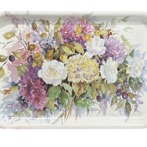May include: A rectangular white serving tray featuring a watercolor-style floral arrangement. The design displays clusters of purple, yellow, and white flowers, including hydrangeas and roses, accented with green leaves and small dark berries.