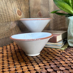 May include: A rustic wooden sign with the text "Welcome to our home" in white lettering. The sign features a distressed finish and a simple, inviting design, perfect for a front porch or entryway.