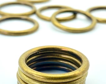 4 bronze-colored round rings Ø 25 mm made of steel