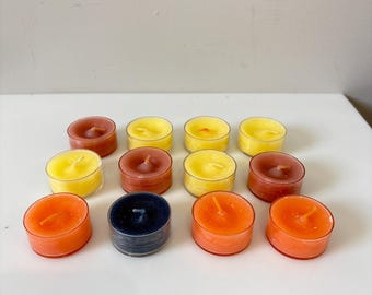 Lot of 12 Assorted Partylite Tealight Candles. Unknown scents. Unburned.