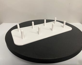 Storage tray for standards spools of thread. Holds 8 spools vertically.