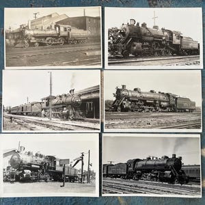 May include: A collection of six vintage black and white photographs featuring steam locomotives. The images showcase various angles and designs of the trains, capturing their presence on railroad tracks and near train stations. The photographs are a nostalgic look at rail travel.