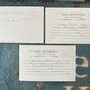 May include: Three vintage postcards with handwritten details and text. One postcard reads "Canadian National 8404" and "Saskatoon Sask. 3-1933." The other two have railroad information and are from Oak Park, Illinois.