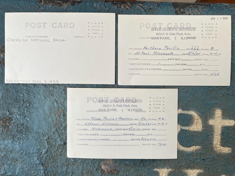 May include: Three vintage postcards with handwritten details and text. One postcard reads "Canadian National 8404" and "Saskatoon Sask. 3-1933." The other two have railroad information and are from Oak Park, Illinois.