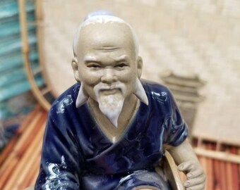 Shi wan Mudman. Such expression on this mid-century oriental Mudman figurines face. All the wisdom of the ages appear to be found here.