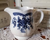 Beautiful blue Carnation Federalist Ironstone creamer. This is a great farm-style piece. Fill with cream, flowers or utensils. Its adorable.