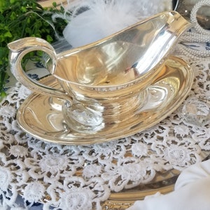 Gorgeous and gleaming Gorham silver plated sauce boat. This elegant silver plated gravy boat has an attached plate beneath. image 3