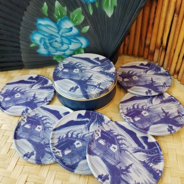 Sweet set of six Oriental themed blue and white coasters with matching tin. These Asian  coasters mimic the design of Blue Willow China.