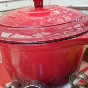 Fabulous vintage Cooks enameled cast iron casserole dish. This gorgeous rustic red cooks enameled Dutch oven is an epic farmhouse piece