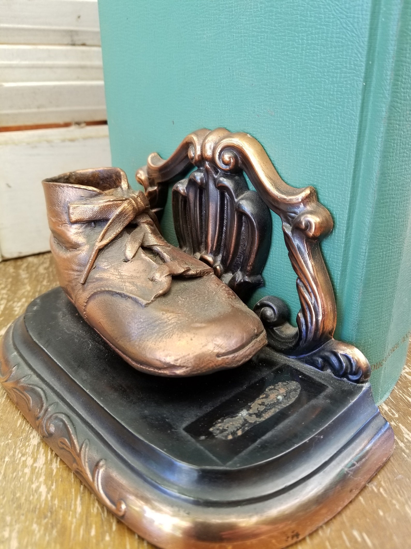 Bronze baby shoes bookends. Remember when these were all the Etsy