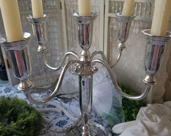 Lovely Victorian inspired Godinger silverplated candelabra. This shimmering silver candelabra would be perfect for your Farmhouse mantle.