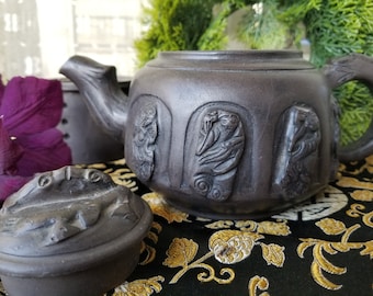 Gorgeous black Japanese clay kyusu teapot. This delightful decorative black clay teapot is a staple in steeping Asian tea.