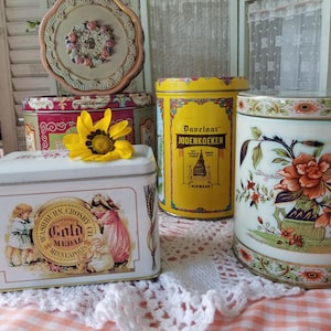 Sweet selection of 5 colorful vintage tins. Each of these delightful vintage tins will add a hint of English cottage core to your space.