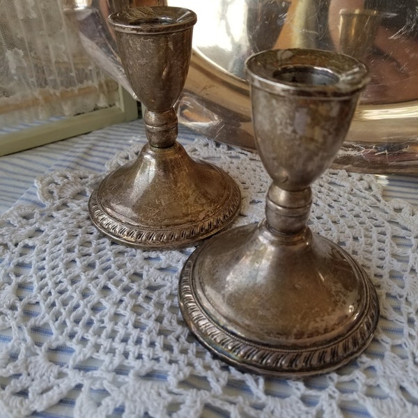 A pair of lovely heavy sterling silver weighted candlestick. This duo of Duchin Sterling silver weighted candlesticks is breathtaking.