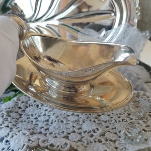 Gorgeous and gleaming Gorham silver plated sauce boat. This elegant silver plated gravy boat has an attached plate beneath. image 6