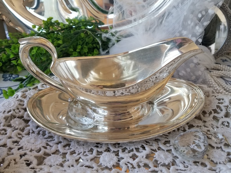 Gorgeous and gleaming Gorham silver plated sauce boat. This elegant silver plated gravy boat has an attached plate beneath. image 2