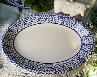Beautiful spongewear blue Italian pottery platter. This huge oval Italian  pottery platter is accented in vibrant sponge pattern blue.