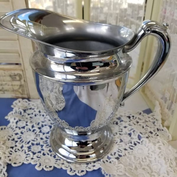 Dazzling retro Chrome plated pitcher. This large vintage Keystone Chrome plated pitcher is great for ice water or even hot drinks.