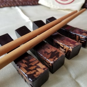Intriguing set of 4 lacquered woven wood Chopstick rest. These lightweight lacquered Chopstick rest are elegant and stylish.