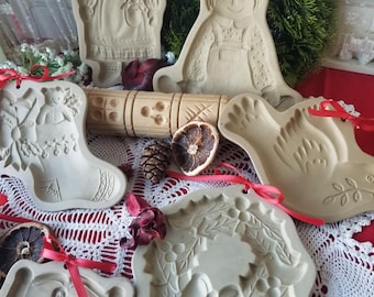 Delightful stoneware Christmas cookie presses. You choose from 7 of these Brown Bag Art Christmas themed stoneware cookie presses.