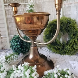 Mid-century solid brass candlestick and amber glass floral bowl combination Flowers and candlelight add a nice touch to any tablescape.