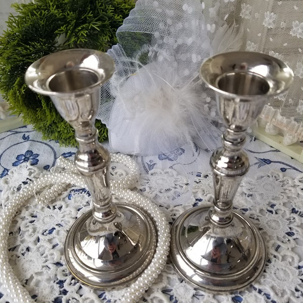 A pair of simple elegant silvered candlesticks. These 2 small silver candlesticks would look lovely in Farmhouse or Cottage.
