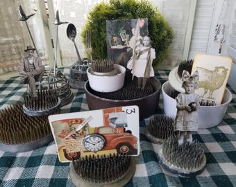 Variety of pincushion and cage flower frogs in varying shapes, sizes and ages. Great for floral designs or unique styling vignettes.