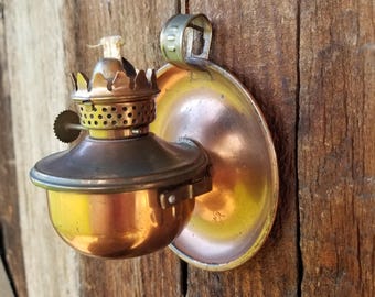 Rustic rotating chamberstick oil lamp. This Charming copper oil lantern lamp would fit beautifully in a cabin, lodge, farmhouse setting.