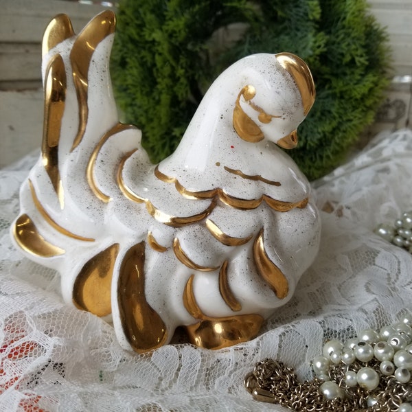 This gorgeous gold gilded hand painted  mid-century ceramic bird is Iconic 1950s decor. I love the speckled effect on this MCM bird.