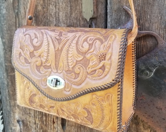 This rustic tooled leather purse is the perfect cowgirl purse. This vintage hand stamped leather purse is the epitome of 1960s Western Wear.