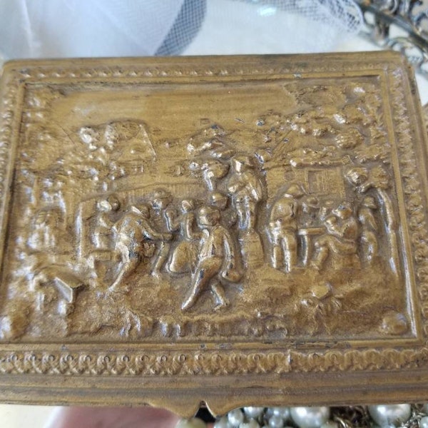 Exquisite cast brass alloy jewelry casket with wood lining. This heavy vintage box, with Dutch village scenery, is classic Holland decor