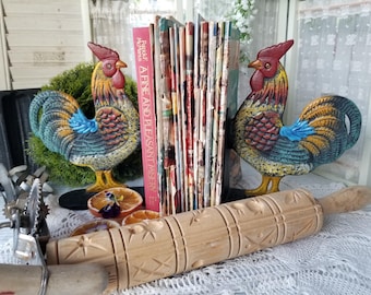 Fabulous heavy Farmhouse rooster bookendss. These colorful heavy cast iron rooster bookends can hold up your Fanny Farmer cookbooks.