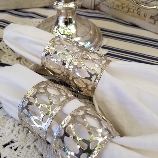 Elegant and gleaming silver napkin rings. This  set of four filigree napkin rings will add a touch of class to your elegant tablescape.