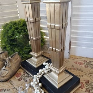 Pair of Regal art deco inspired heavy brass candlesticks. These two squared column candlesticks speak of 1920s Elegance and Style.