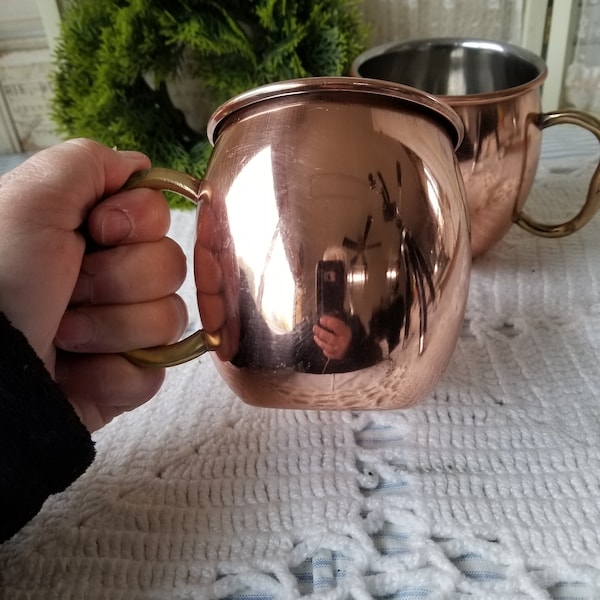 Pair of vintage  coppered Moscow Mule mugs. These two Moscow Mule mugs are perfect for those warm drinks around the fireplace.