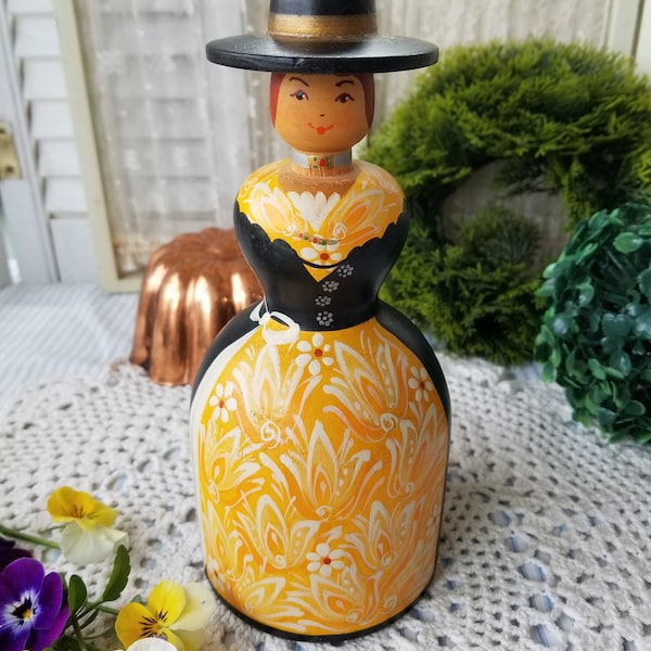 Sweet little hand-painted wooden doll. This quaint hand painted wooden lady candle holder appears to be handcrafted in Eastern Europe.