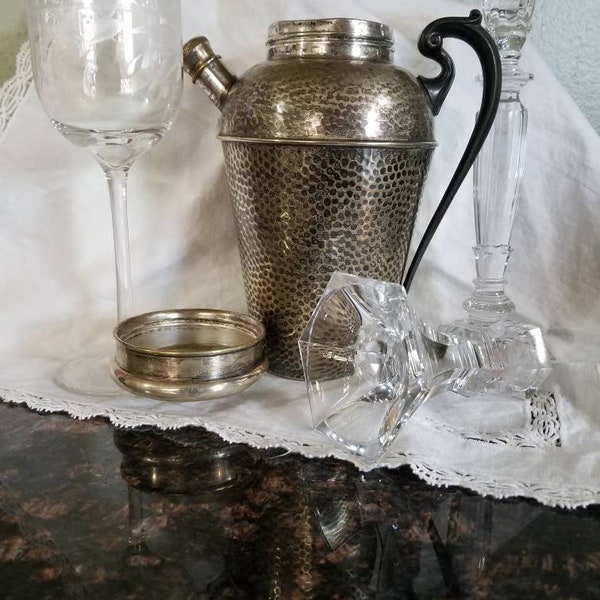 Antique hammered silverplated cocktail shaker. This beautiful English-made silverplated cocktail shaker is antique sophisticated barware.