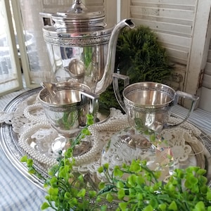 Exquisite 3 piece antique Knickerbocker Silver Co. coffee service. This antique trio consists of coffee pot,  creamer & sugar bowl.