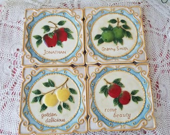 Adorable set of 4 vibrant Apple themed ceramic tiles. These 4 fabulous ceramic tiles belong in your colorful Farmhouse Apple kitchen.