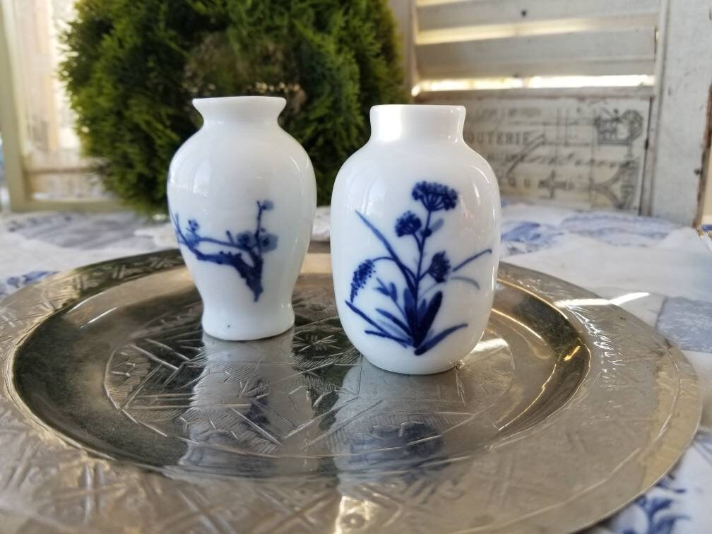 Delightful Duo of two small oriental vases with Chinese cobalt artwork. This pair Asian inspired vases perfect Oriental Decor elements