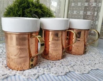 Rustic set of three vintage copper cups with white ceramic insert. Each of these vintage copper cups are in rustic shape, liners are great.
