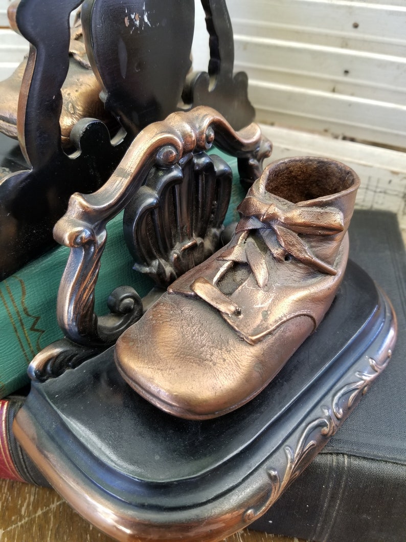 Bronze baby shoes bookends. Remember when these were all the Etsy