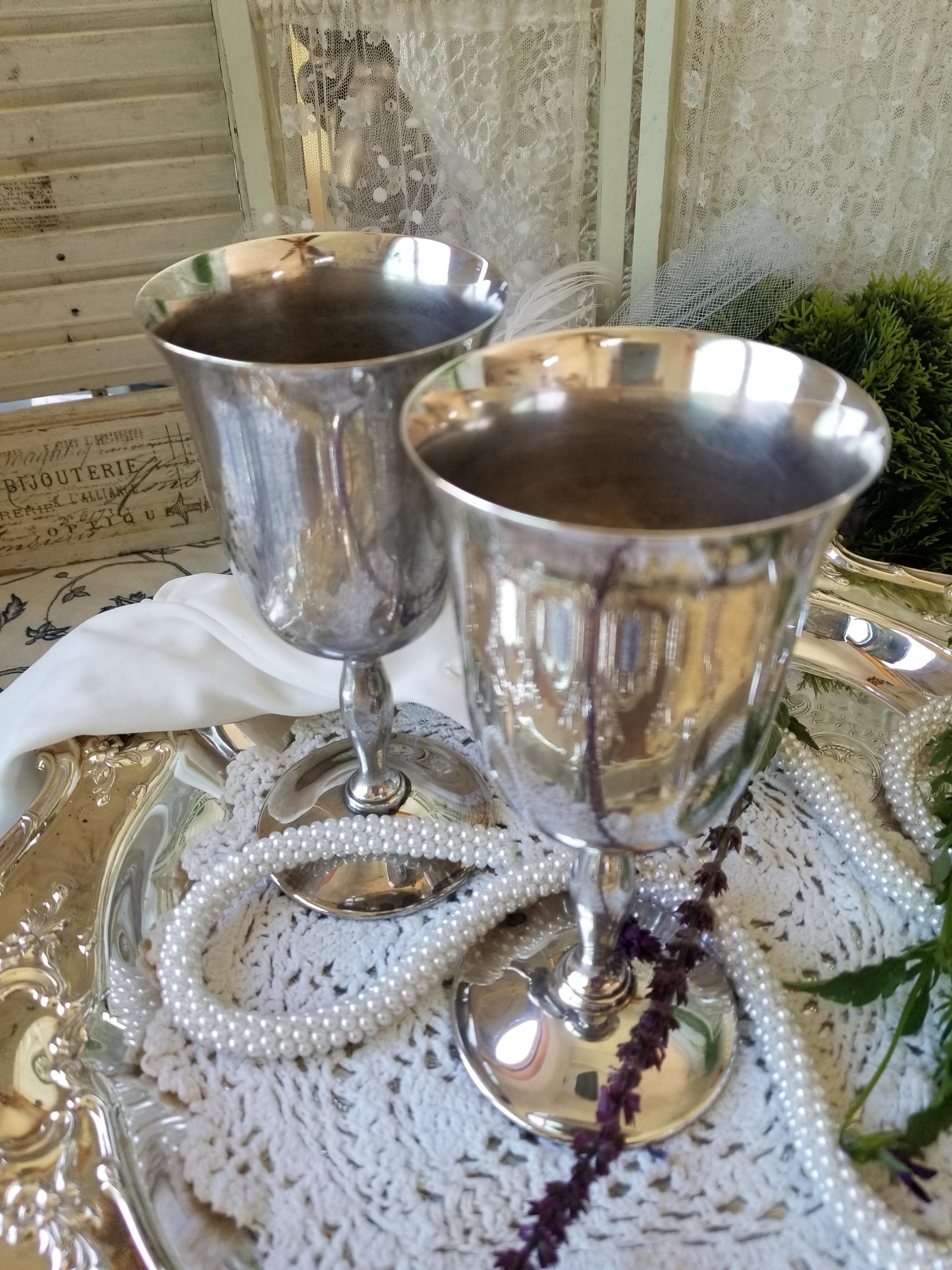 Pair of rustic silverplated wine goblets. These 2 slightly tarnished silver plated wine chalices would be perfect for a Renaissance affair.