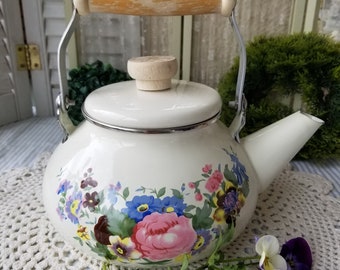 Vintage enameled tea kettle. This gorgeous flower adorned cream tea kettle is perfect for a steaming cup of tea with a hint of Farmhouse cha